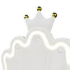 Close-up of a white upholstered bed headboard with a crown design and integrated LED lighting. Produktbild-Vorschau