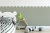 A child's bedroom with a bed, wall decorations, and toys. Podgląd zdjęcia produktu