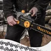 A person is holding an electric chainsaw with a pile of wood in the background. Náhled obrázku produktu