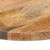 Close-up view of the edge of a round wooden table surface. Náhled obrázku produktu