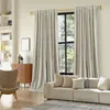 A living room scene with a sofa, armchair, dresser, and curtains. Produktbild-Vorschau