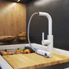 A modern kitchen sink area with a white pull-out faucet, a wooden cutting board, and oranges in a sink rack. Anteprima dell’immagine prodotto