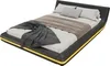 A modern black bed with yellow LED lighting around the base, shown from a diagonal angle. Produktbild-Vorschau