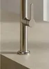 A close-up shot of a modern kitchen faucet handle and base. Produktbild-Vorschau