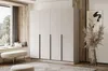A bedroom scene featuring a large wardrobe, a window seat with cushions, a bench, and decorative elements. Produktbild-Vorschau