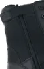 A close-up view of a black boot, showing the side zipper and the Magnum logo. Produktbild-Vorschau
