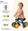A young child is riding a balance bike, with feature callouts on the left side. Anteprima dell’immagine prodotto
