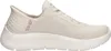 A side view of a single beige Skechers women's sneaker against a white background. Náhľad obrázku produktu