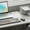 A desk setup with a laptop, keyboard, mouse, and document tray. Produktbild-Vorschau