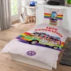 A bedding set with a VW bus design is displayed on a bed in a bedroom setting. Produktbild-Vorschau