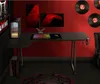 A gaming desk setup with dual monitors, a colorful keyboard, and a PC tower on the floor. The wall is red and decorated with vinyl records. Anteprima dell’immagine prodotto