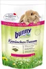 A bag of bunny food with a young rabbit peeking over the top. Produktbild-Vorschau