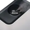 A close-up view of the top of a humidifier emitting a mist. Produktbild-Vorschau