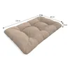 A beige cushion with tufting, shown with dimensions indicated by lines and text. Voir les images du produit