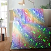A colorful, glow-in-the-dark unicorn blanket draped over a sofa. Anteprima dell’immagine prodotto