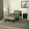 A bedroom scene with a bed, lamp, and nightstand. Produktbild-Vorschau