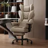 A khaki ergonomic office chair is shown in a modern office setting, next to a desk and bookshelf. Produktbild-Vorschau