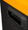 A close-up view of the textured black side of a cooler with an orange top, showing a recessed handle. Produktbild-Vorschau