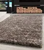 A shaggy rug in front of a fireplace with stacked logs. Podgląd zdjęcia produktu