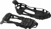 A pair of black overshoes with metal spikes for traction on ice and snow, shown against a white background. Produktbild-Vorschau