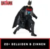 A Batman action figure with a wingsuit, posed dynamically against a white background. The Batman logo is visible in the top left corner, and text indicating features is at the bottom. Anteprima dell’immagine prodotto