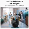 A security camera is shown in the foreground, with two dogs and a girl in the background, all within highlighted detection zones. Produktbild-Vorschau