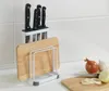 A kitchen counter with a knife block, cutting board holder, and some vegetables. Produktbild-Vorschau