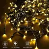 A tangled pile of yellow LED string lights with black wires. Anteprima dell’immagine prodotto
