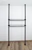 A black wire shelving unit with two baskets is shown against a white wall and wooden floor. Náhled obrázku produktu