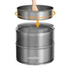 A hand is shown placing the top part of a metal fire pit onto the main body. Produktbild-Vorschau