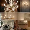 A collage of images showing various chandeliers and dining room settings, with a focus on lighting. Anteprima dell’immagine prodotto