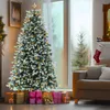 A decorated Christmas tree with presents underneath, in a living room setting. Produktbild-Vorschau