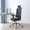 An office chair is placed next to a desk in a well-lit room with blue curtains. Náhled obrázku produktu