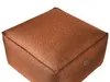 A close-up, studio shot of a square brown pouf on a white background. Náhled obrázku produktu