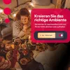 People enjoying a meal together with decorative lights in the background. Produktbild-Vorschau