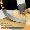A gloved hand is using a Japanese pull saw to cut a wooden dowel. Sawdust is scattered around the work area. Náhled obrázku produktu