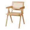 A light-colored wooden chair with a woven seat and backrest, presented against a white background. Produktbild-Vorschau