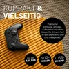 A black video game controller rests on a textured yellow surface. Text overlays and circular icons are present. Náhled obrázku produktu