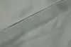 A close-up of gray fabric with a seam. Produktbild-Vorschau