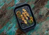 A grill pan with shrimp skewers, lemon slices, and herbs on a rustic wooden table. Náhľad obrázku produktu
