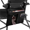 A close-up view of a black fabric organizer attached to the armrest of a black chair. Produktbild-Vorschau