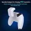 A white PS5 controller with a white charging attachment on a dark blue gradient background. Náhľad obrázku produktu
