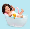 A doll is taking a bath in a toy bathtub with bubbles and a rubber duck. Produktbild-Vorschau