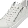 A close-up view of a white sneaker with silver accents. Náhľad obrázku produktu