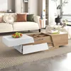 A modern living room scene featuring a white and wood-tone coffee table with storage and drawers, placed on a rug in front of a sofa. Náhľad obrázku produktu
