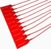 A group of red plastic security seals laid out diagonally on a white background. Náhled obrázku produktu