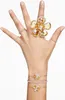 A hand adorned with multiple rings and bracelets, showcasing jewelry. Anteprima dell’immagine prodotto
