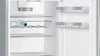 Interior view of a refrigerator with a bottle on a shelf. Produktbild-Vorschau