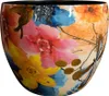 A close-up view of a decorative bowl with a vibrant floral pattern. Anteprima dell’immagine prodotto
