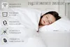 A young girl sleeping peacefully on a white mattress, covered by white bedding. The image has informational icons and text on the left side. Voir les images du produit